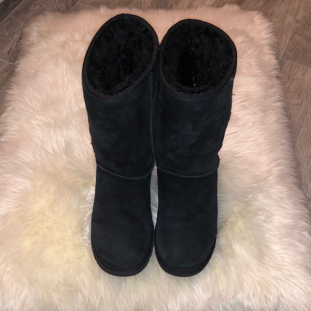 Uggs tall black fur lined boots. Size 7